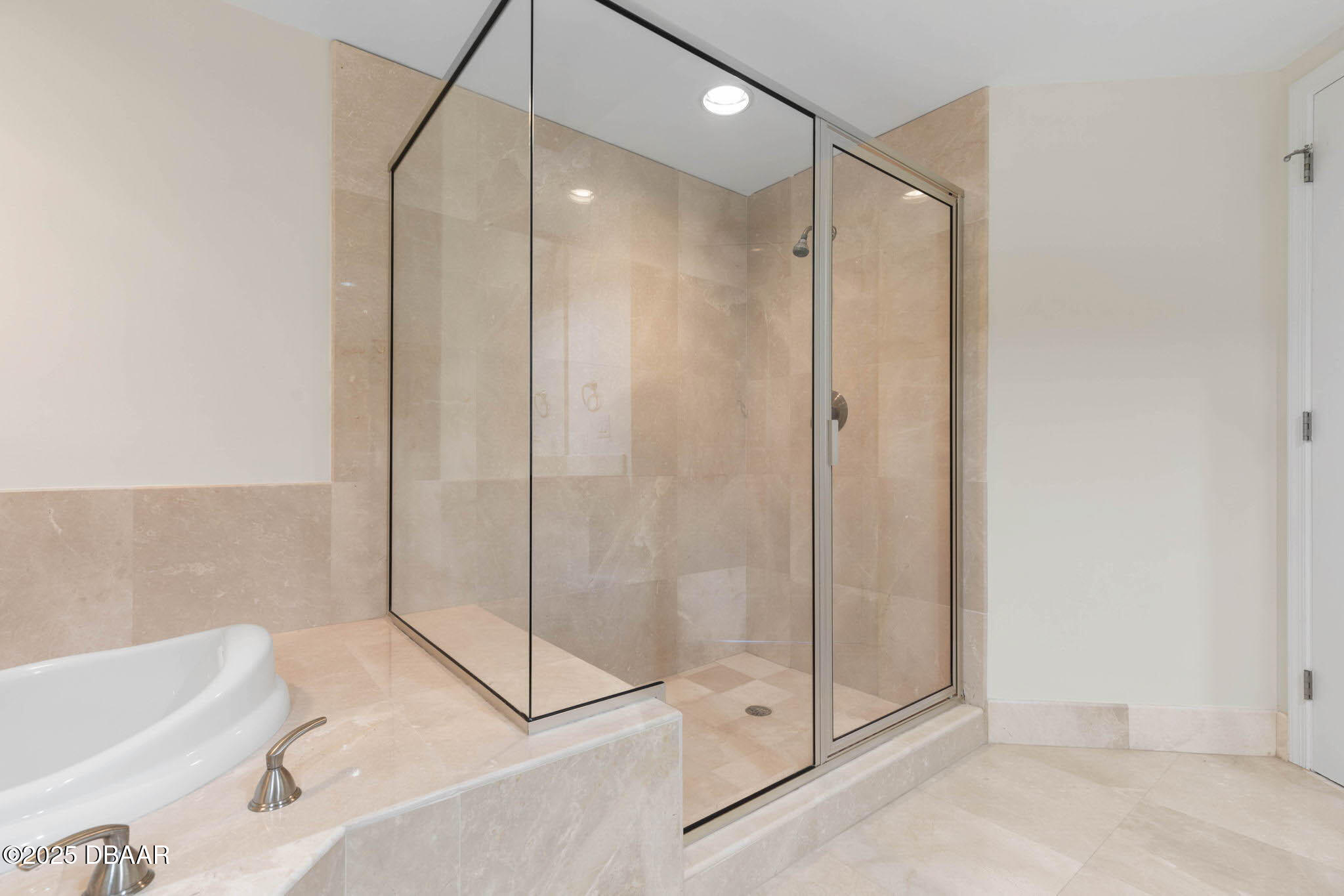 241 Riverside Drive, Unit 708 Holly Hill, FL 32117 - Photo 32 of 80 a bathroom with a shower and a bathtub