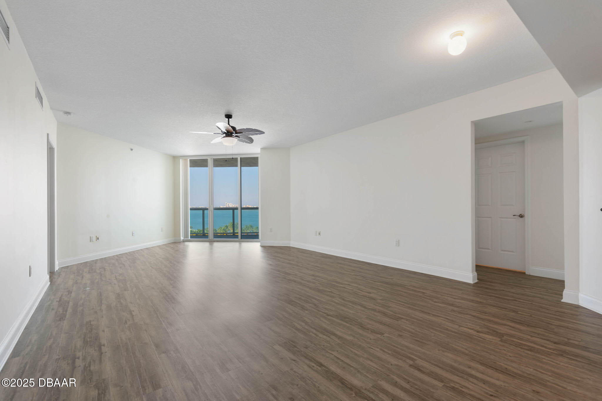 241 Riverside Drive, Unit 708 Holly Hill, FL 32117 - Photo 35 of 80 an empty room with wooden floor and windows
