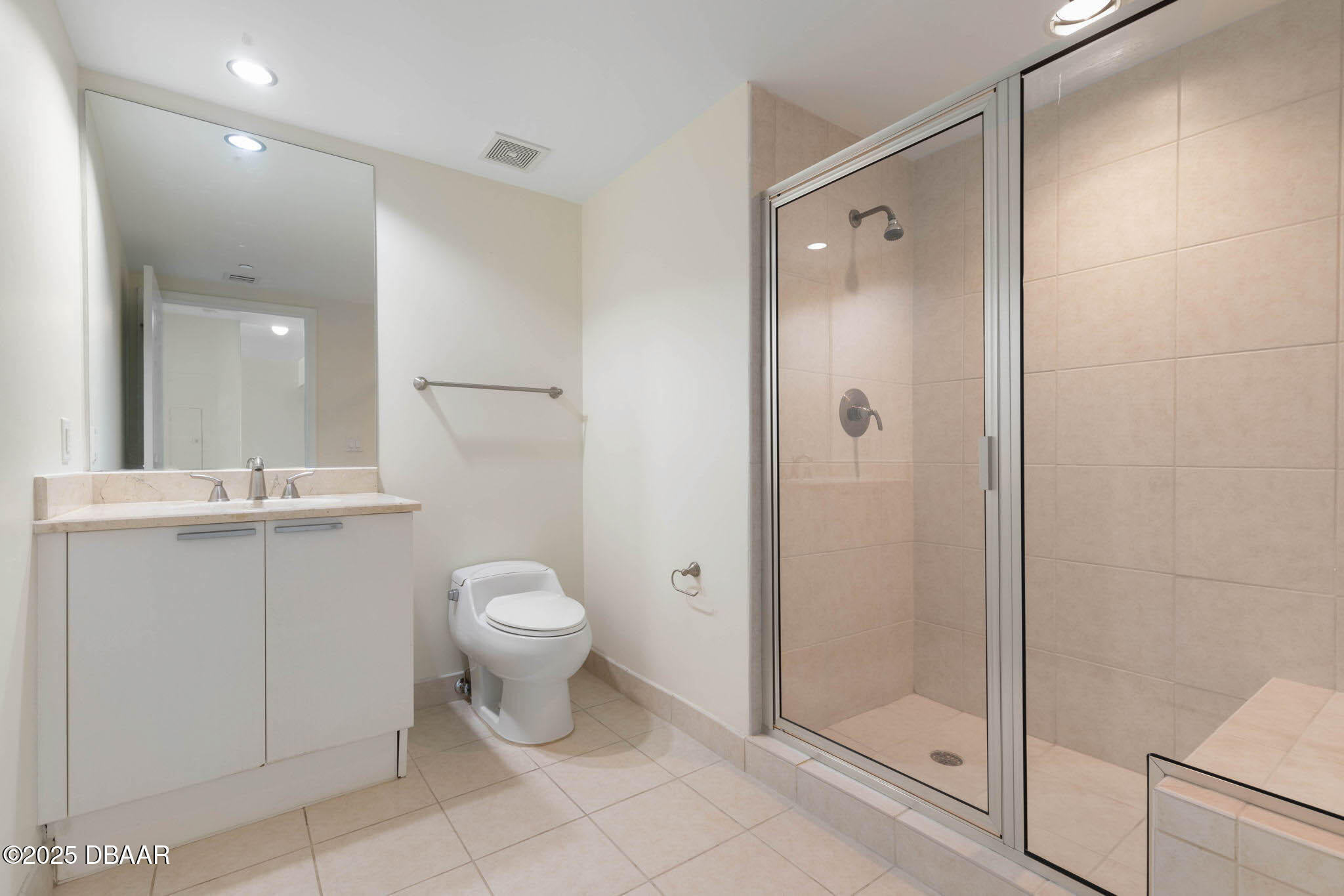 241 Riverside Drive, Unit 708 Holly Hill, FL 32117 - Photo 40 of 80 a bathroom with a toilet sink and shower