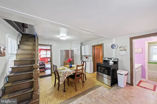 a bathroom with a sink mirror and vanity