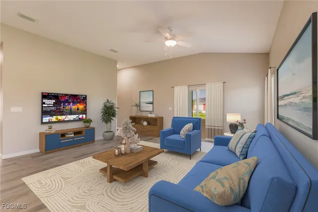 a living room with furniture and a flat screen tv