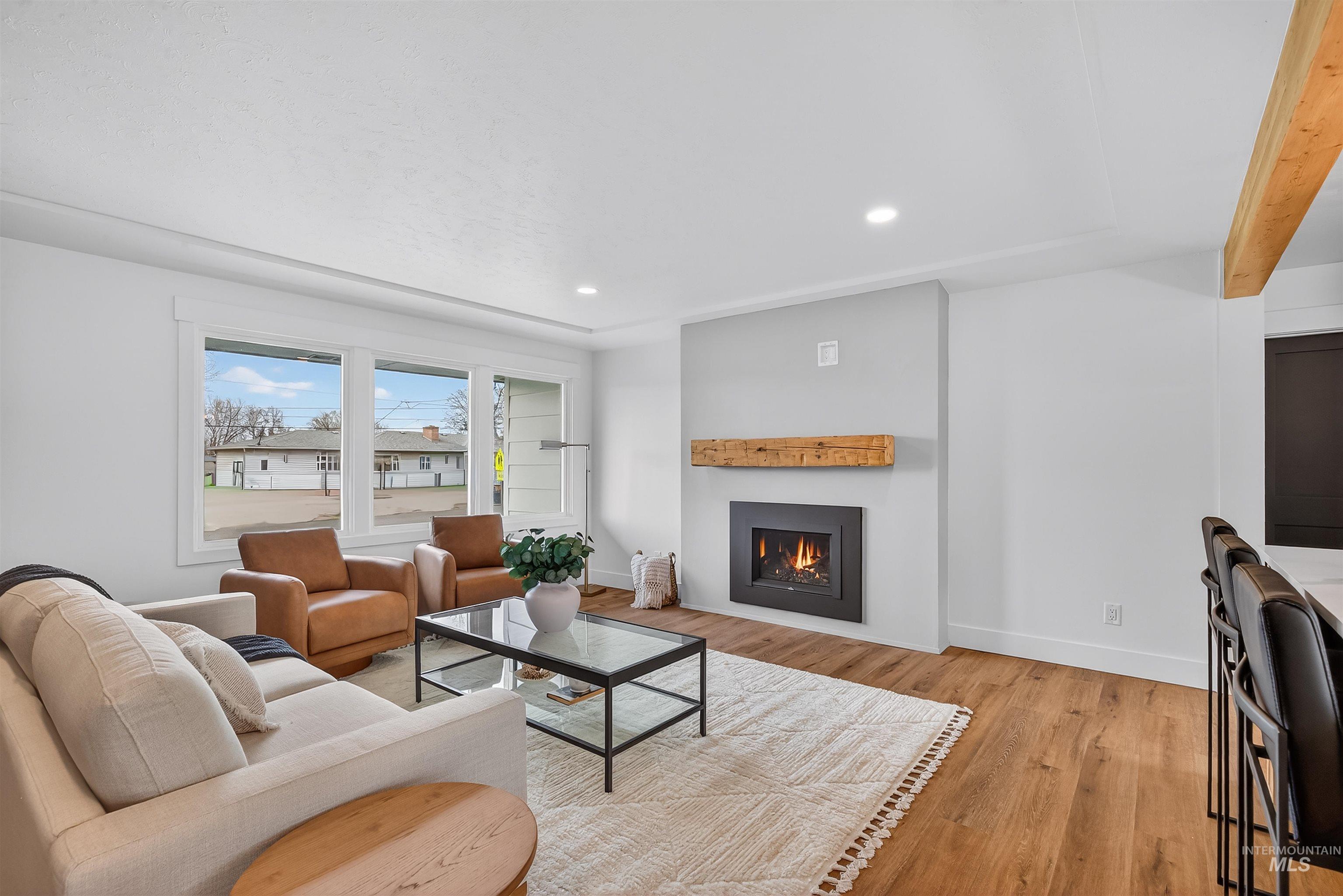 3513 8th Street Lewiston, ID 83501 - Photo 19 of 43 Living room with recessed lighting, light wood-type flooring, and a fireplace