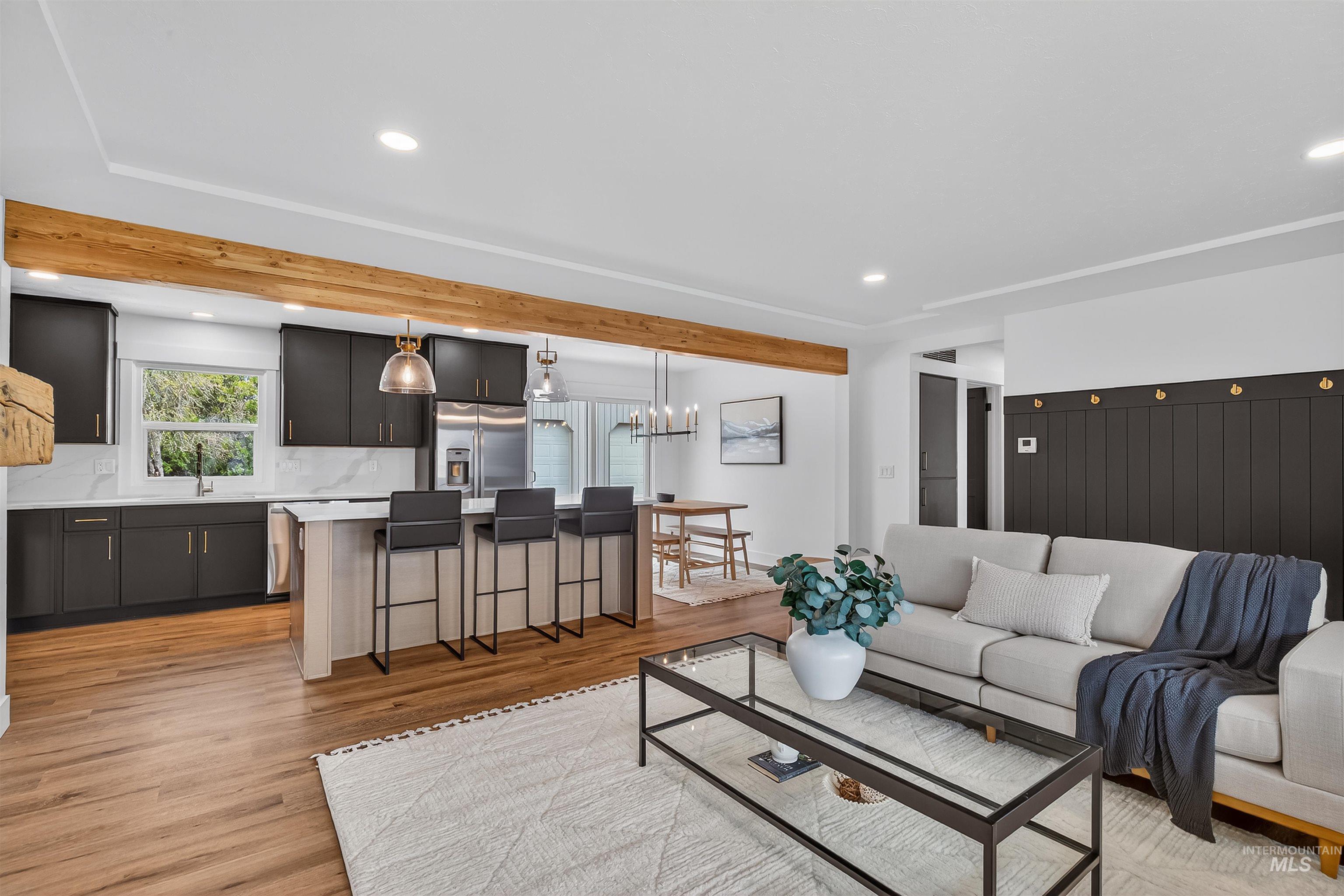 3513 8th Street Lewiston, ID 83501 - Photo 23 of 43 Living room with light wood-style flooring and a chandelier