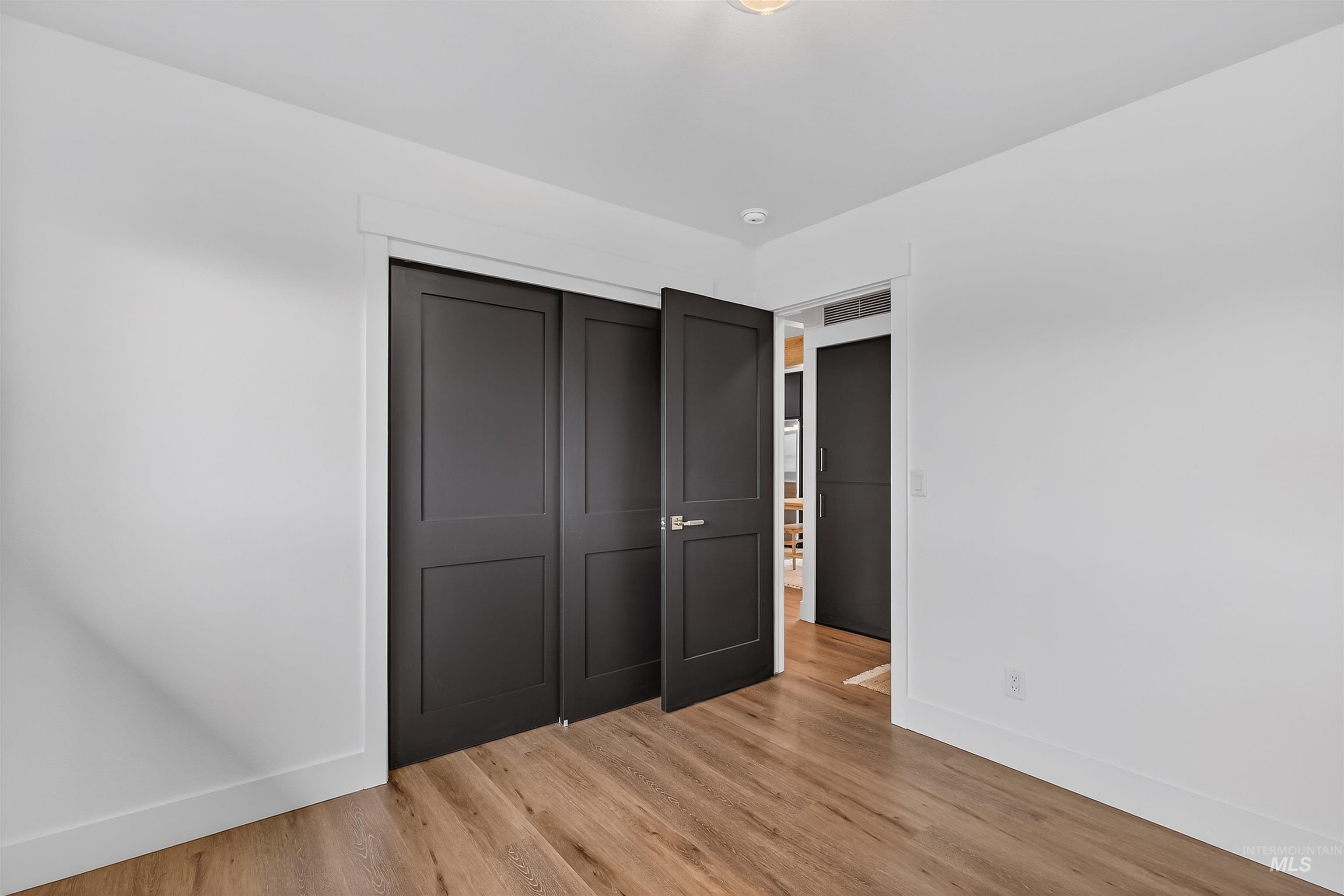 3513 8th Street Lewiston, ID 83501 - Photo 27 of 43 Unfurnished bedroom featuring light wood finished floors and a closet