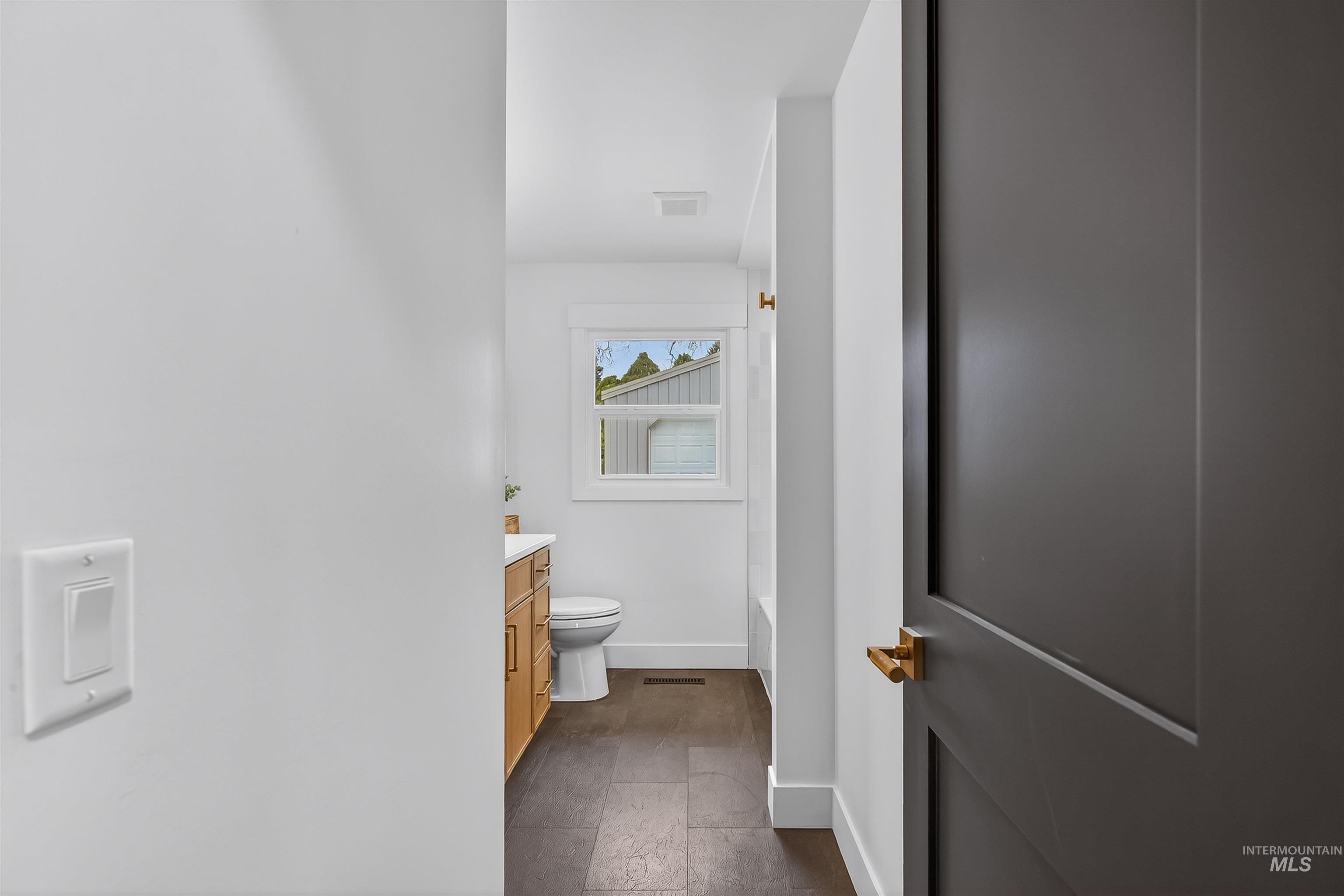 3513 8th Street Lewiston, ID 83501 - Photo 28 of 43 Bathroom with vanity and dark stone finish flooring