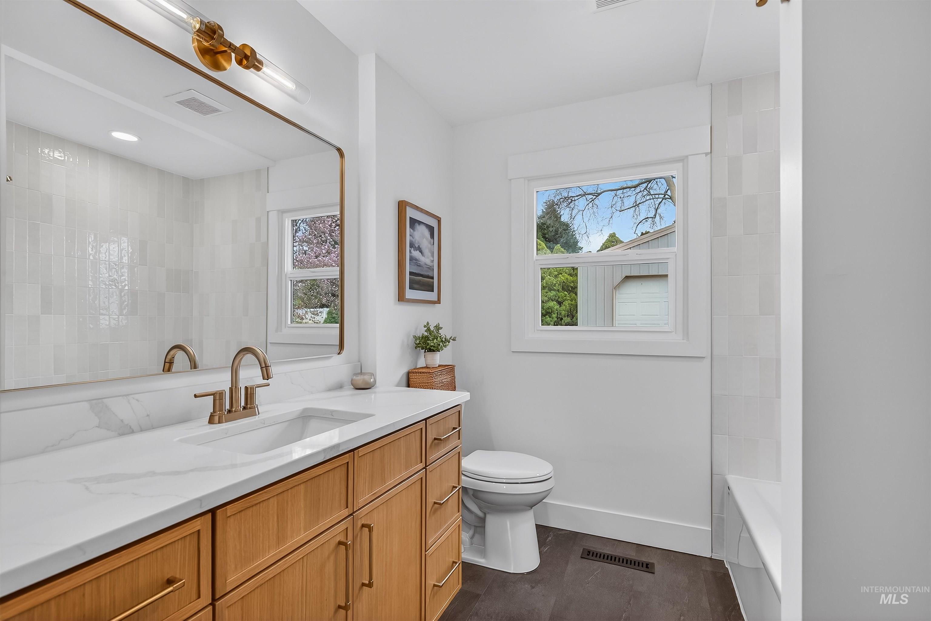 3513 8th Street Lewiston, ID 83501 - Photo 29 of 43 Full bathroom featuring vanity and dark wood-style floors