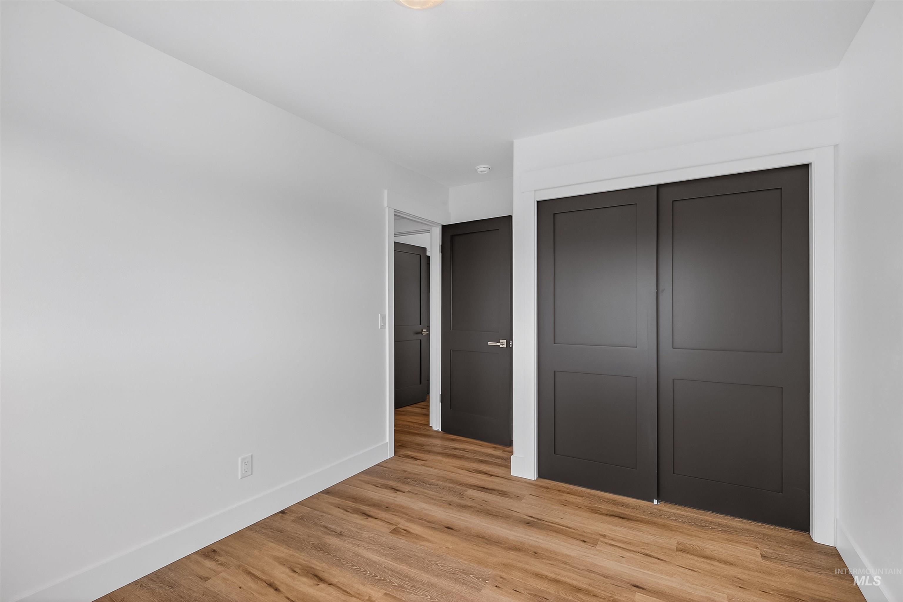 3513 8th Street Lewiston, ID 83501 - Photo 33 of 43 Unfurnished bedroom with light wood-type flooring and a closet