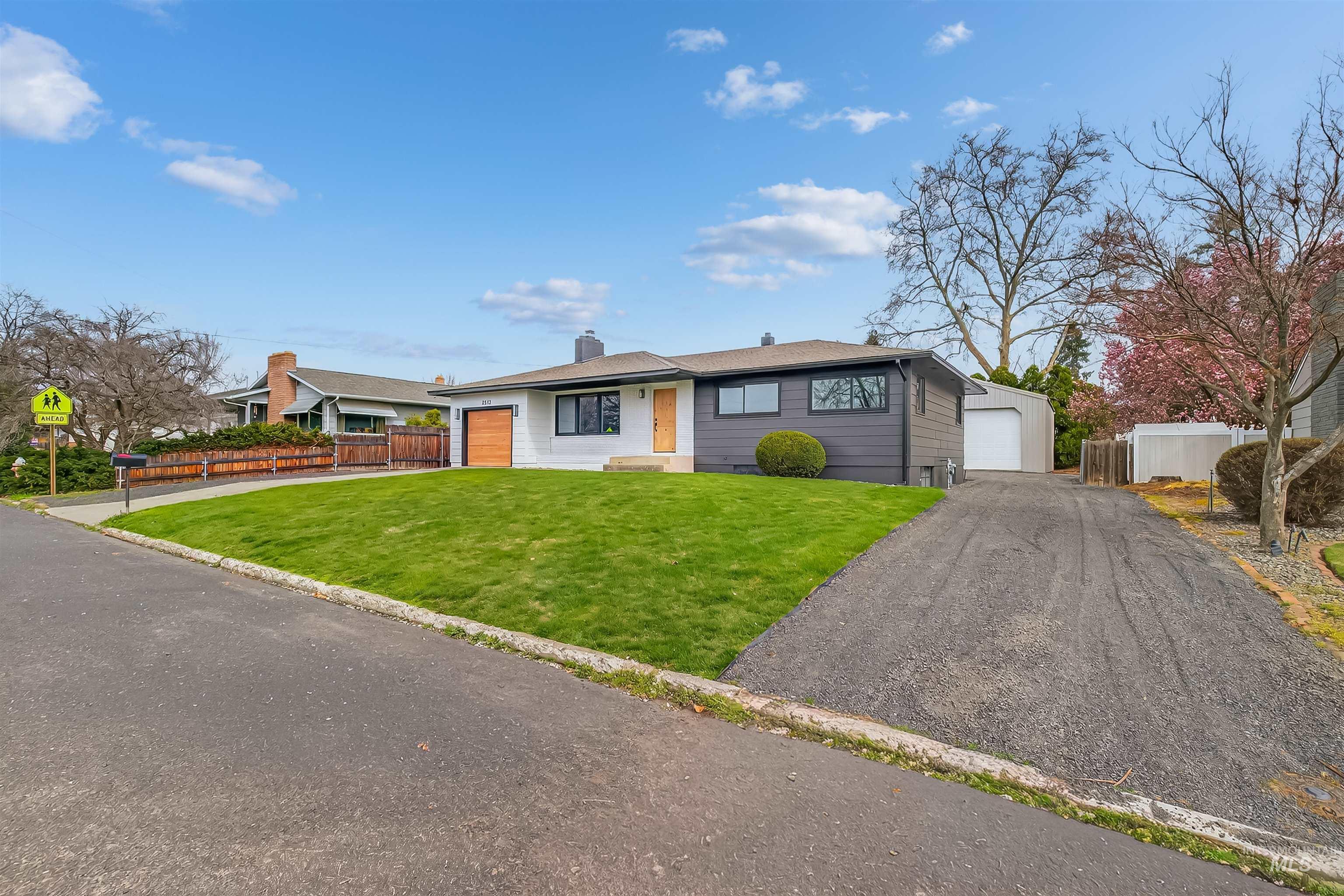3513 8th Street Lewiston, ID 83501 - Photo 4 of 43 View of front of property with a chimney and a garage