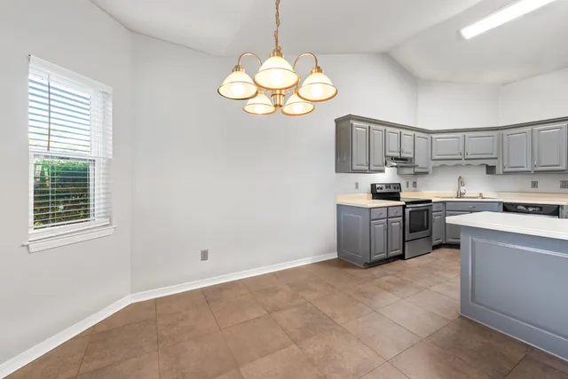a kitchen with a cabinets and window
