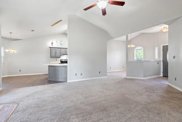 a view of a kitchen with a sink and a kitchen counter top
