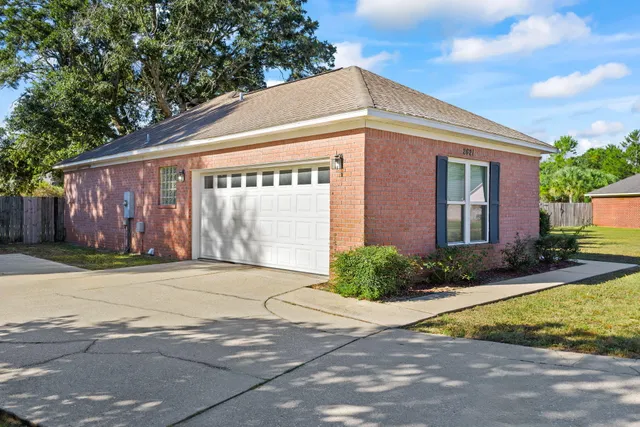 a front view of house with garage and yard