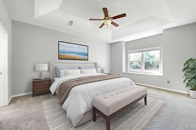 a bedroom with bed and a window