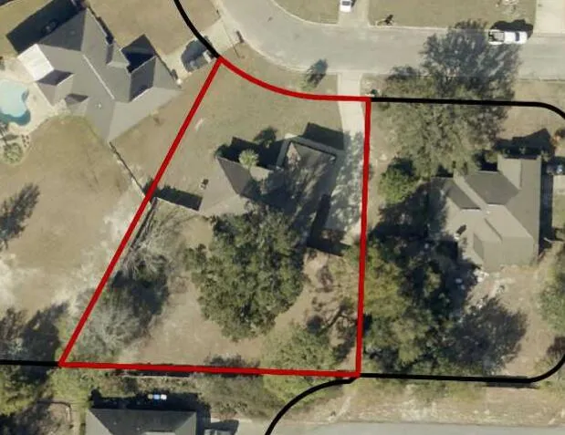 a front view of house with yard and trees