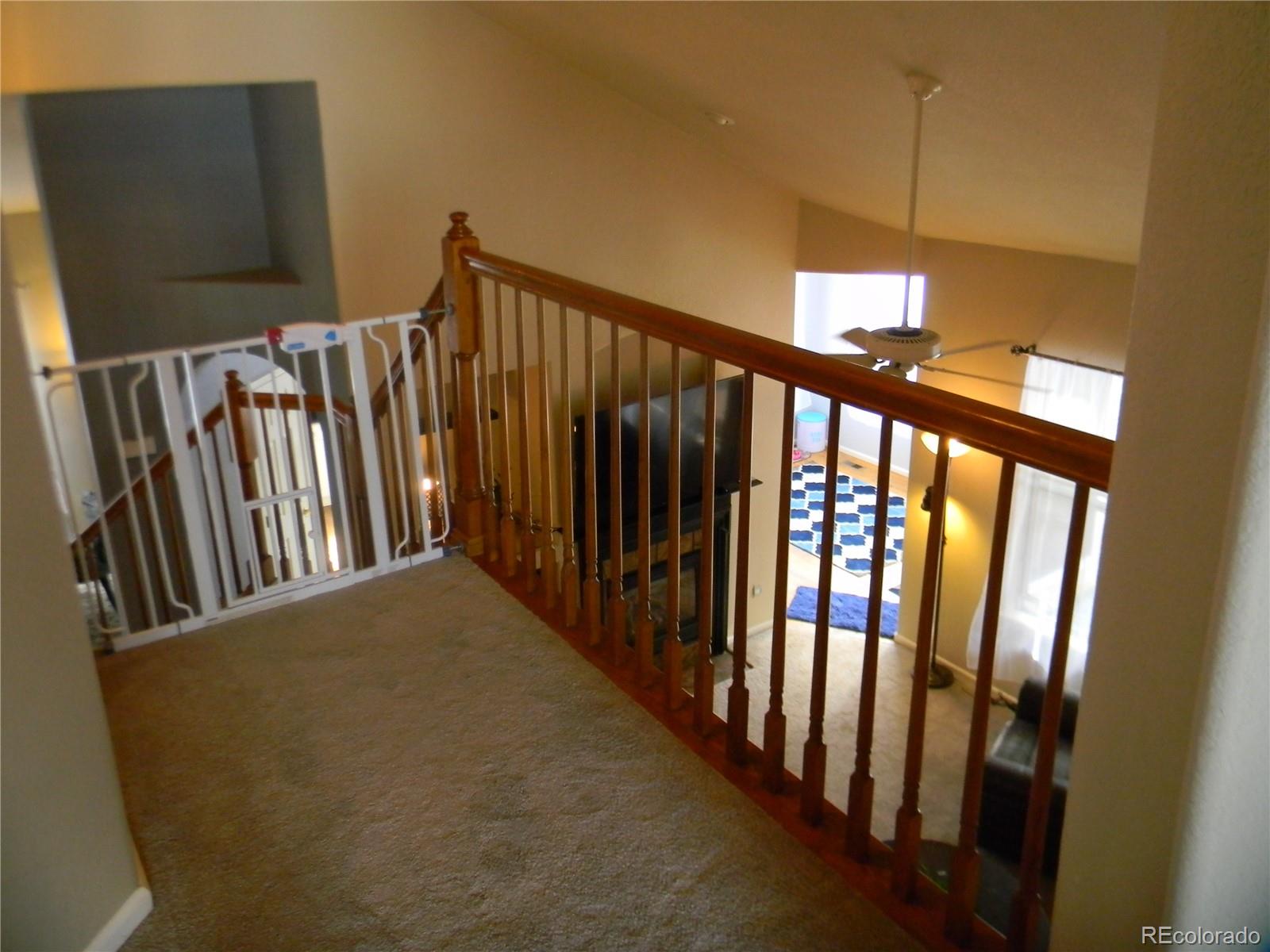 4092 Starflower Road Castle Rock, CO 80109 - Photo 12 of 28 a view of a hallway with stairs