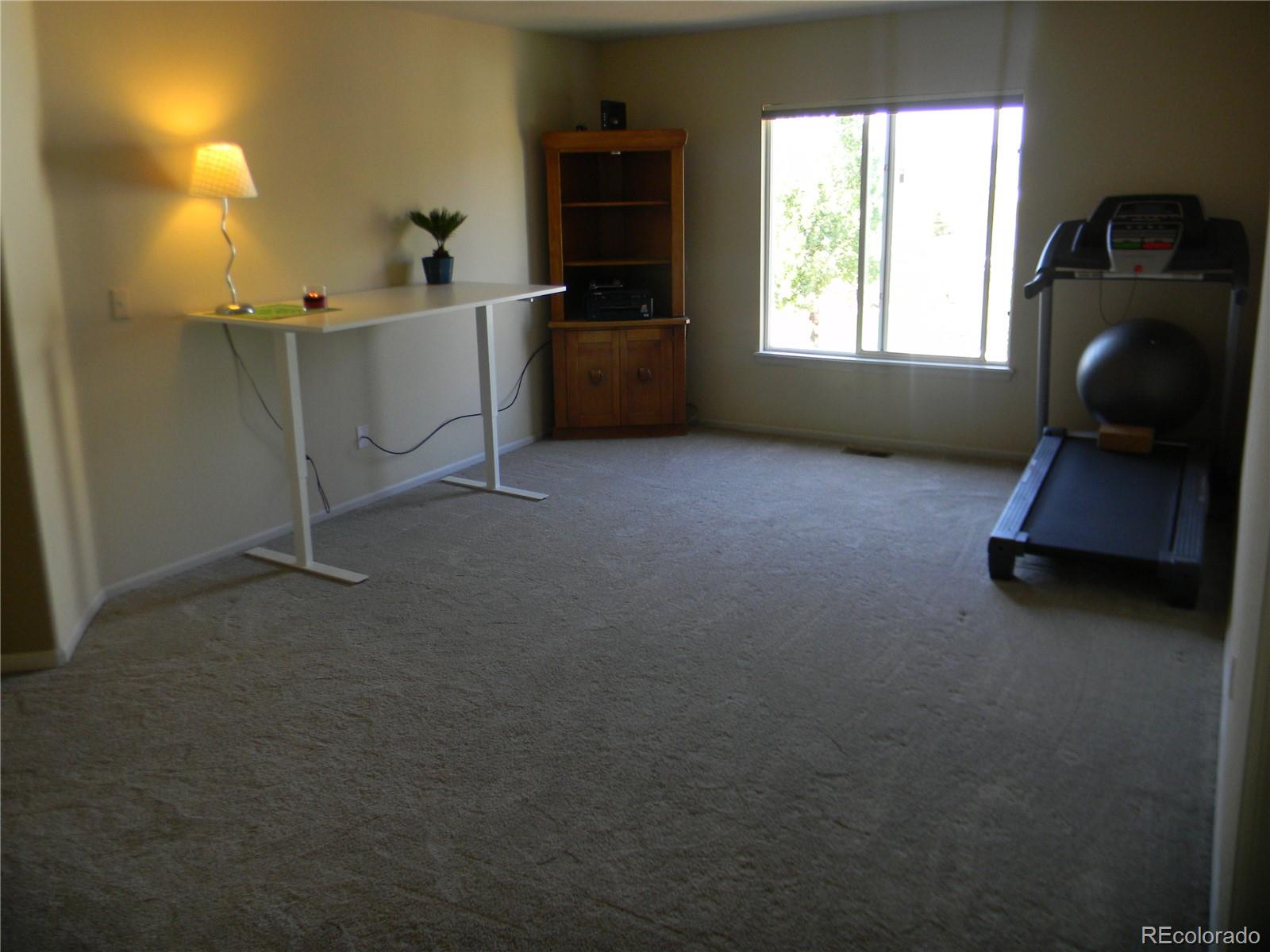 4092 Starflower Road Castle Rock, CO 80109 - Photo 18 of 28 a room with window and workspace