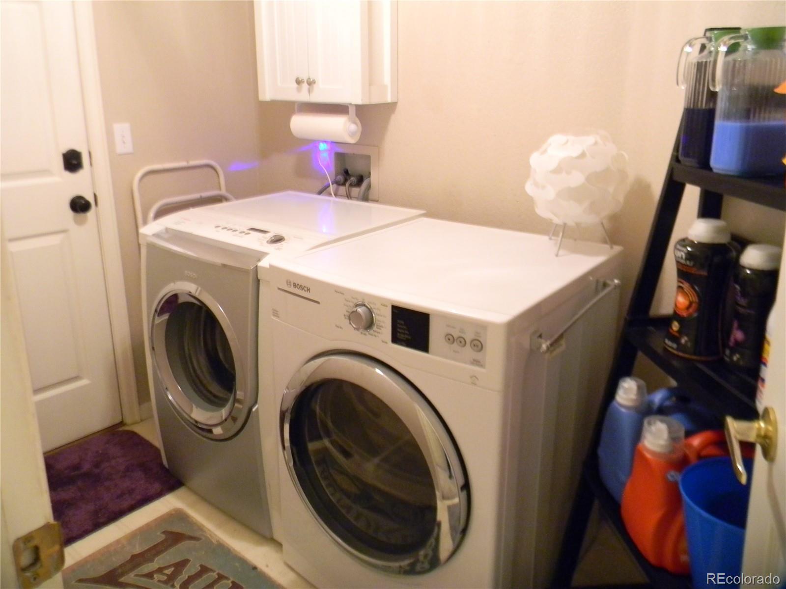 4092 Starflower Road Castle Rock, CO 80109 - Photo 19 of 28 a utility room with dryer and washer