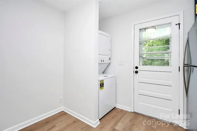 a view of an entryway with wooden floor