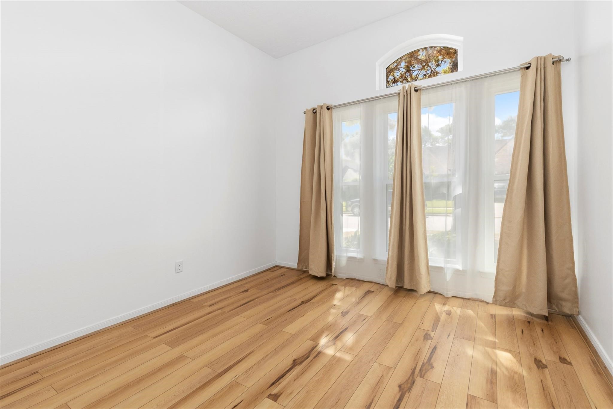 3406 Meadowlark Lane Spring, TX 77388 - Photo 17 of 19 a view of a room with wooden floor and a window