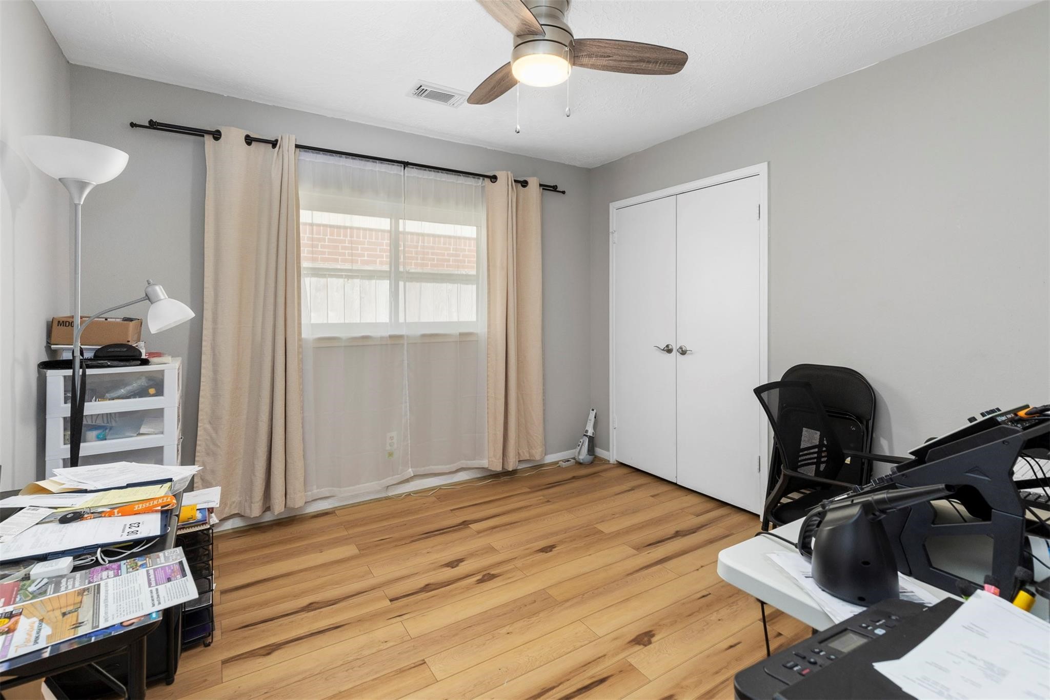 3406 Meadowlark Lane Spring, TX 77388 - Photo 18 of 19 a bedroom with a bed and wooden floor