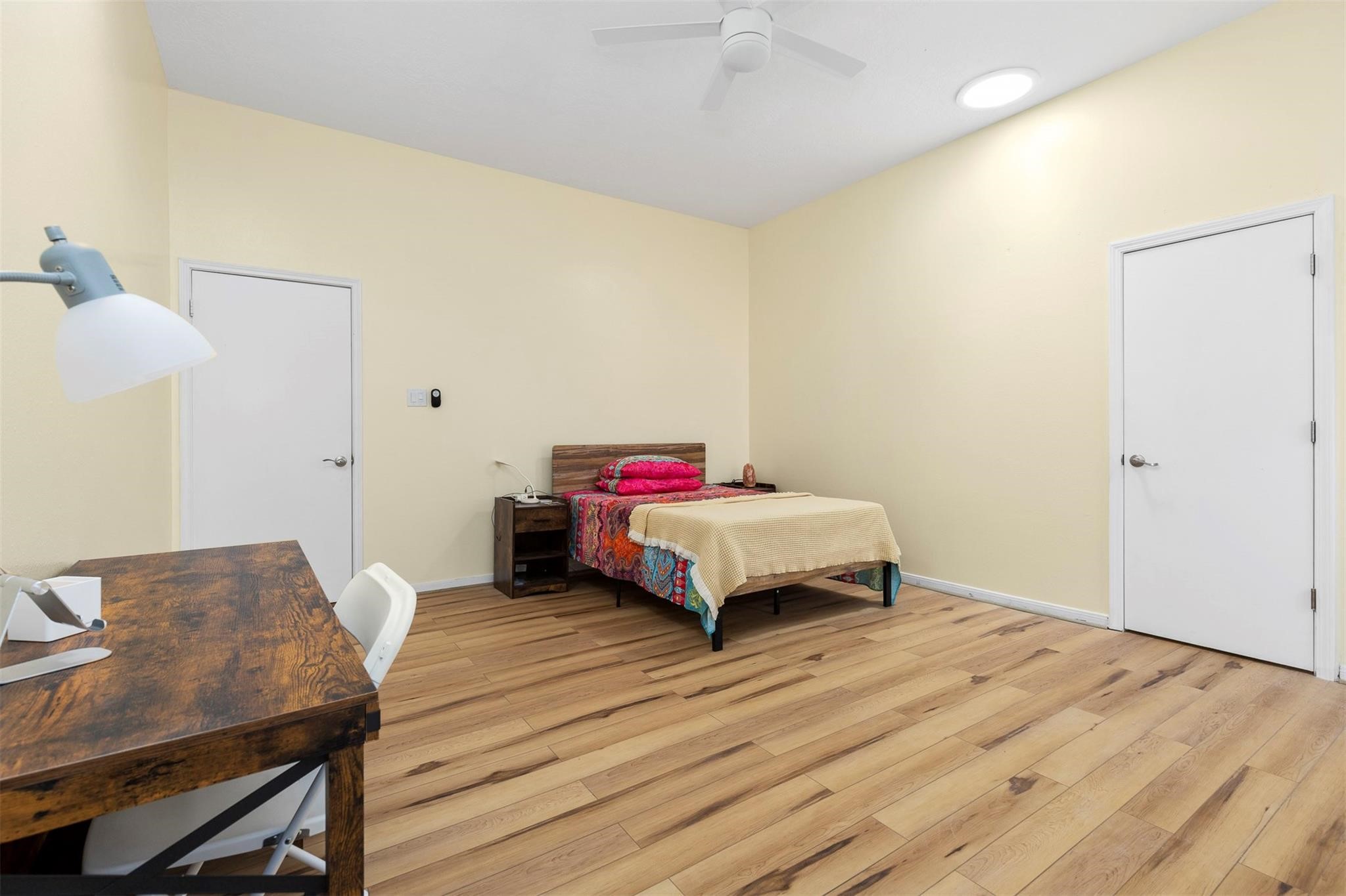 3406 Meadowlark Lane Spring, TX 77388 - Photo 6 of 19 a bedroom with a bed and a table