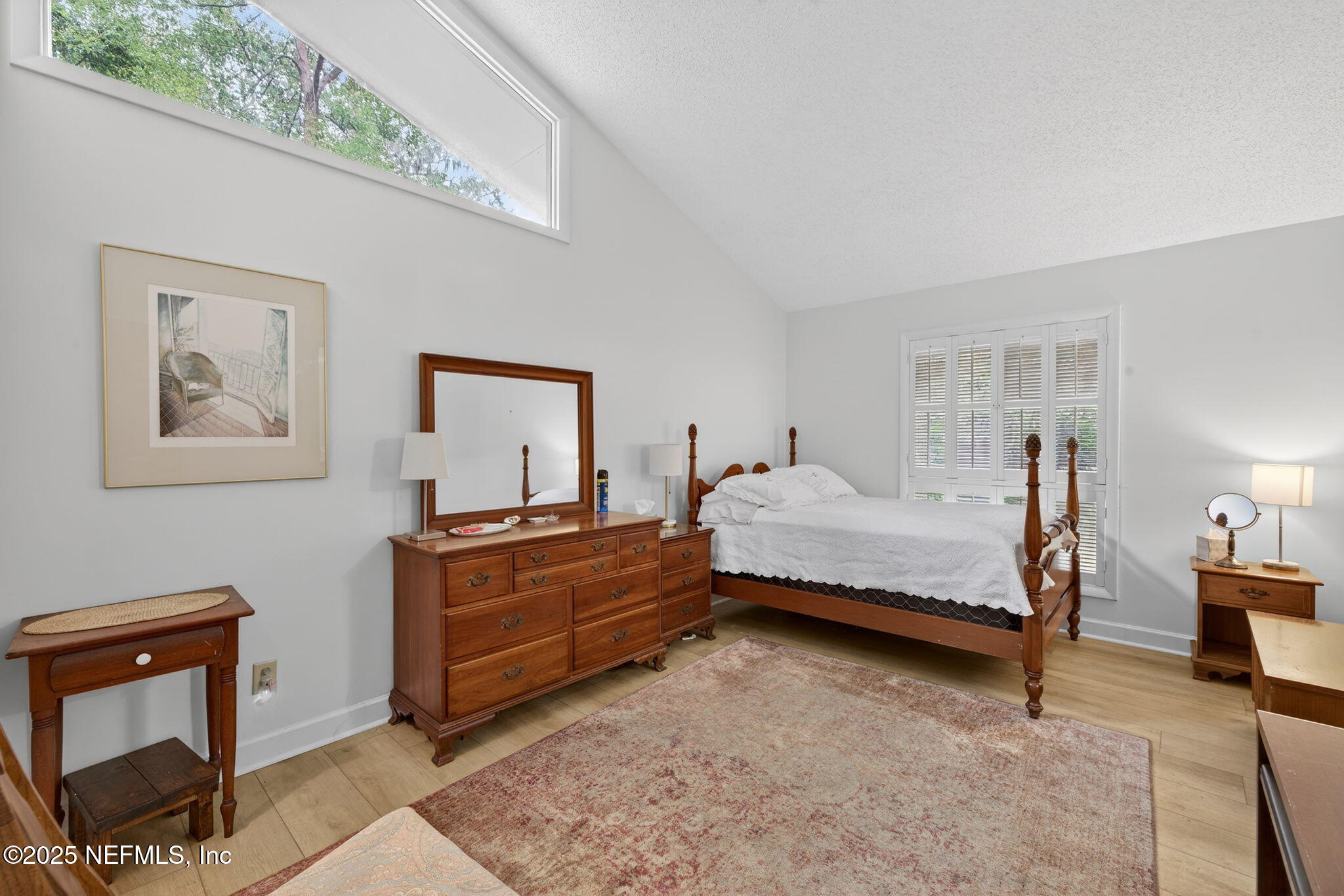 4980 Morven Road Jacksonville, FL 32210 - Photo 18 of 35 a bedroom with a bed and a dresser in it