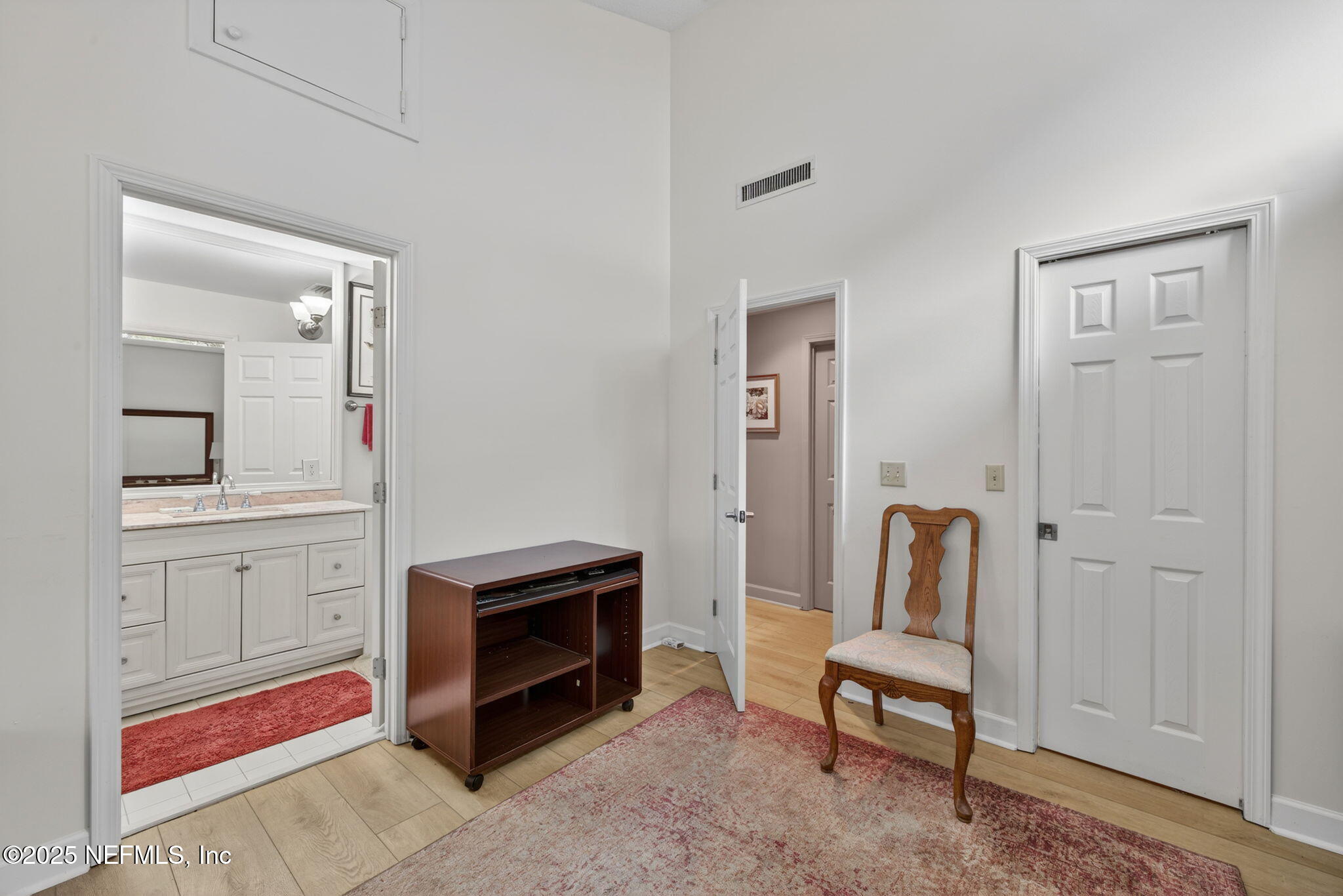 4980 Morven Road Jacksonville, FL 32210 - Photo 20 of 35 a bedroom with furniture and a mirror