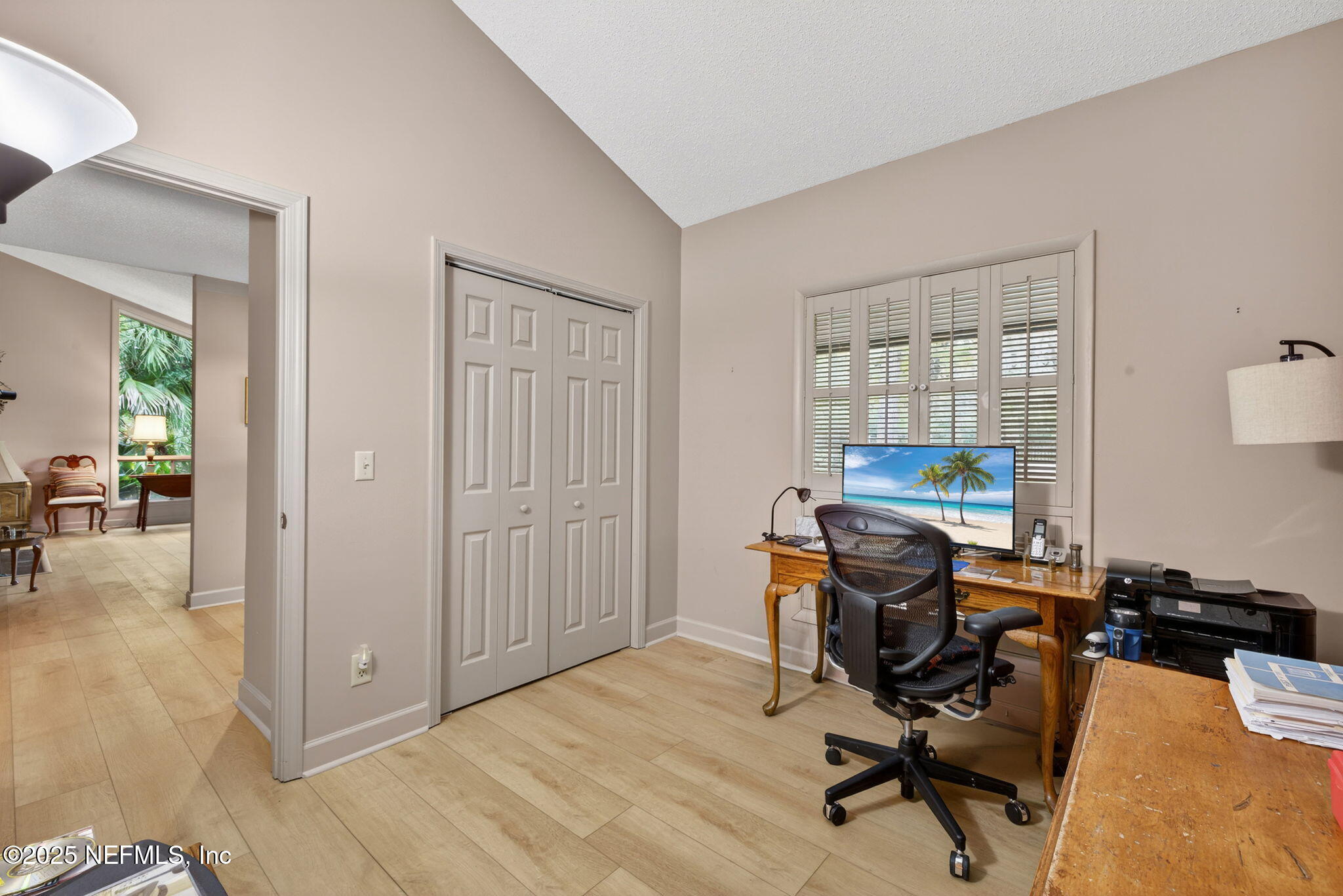4980 Morven Road Jacksonville, FL 32210 - Photo 24 of 35 a view of a workspace with furniture and a window