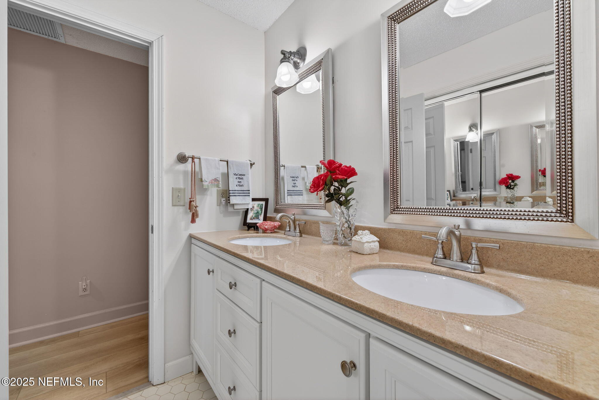 4980 Morven Road Jacksonville, FL 32210 - Photo 25 of 35 a bathroom with a double vanity sink and a mirror