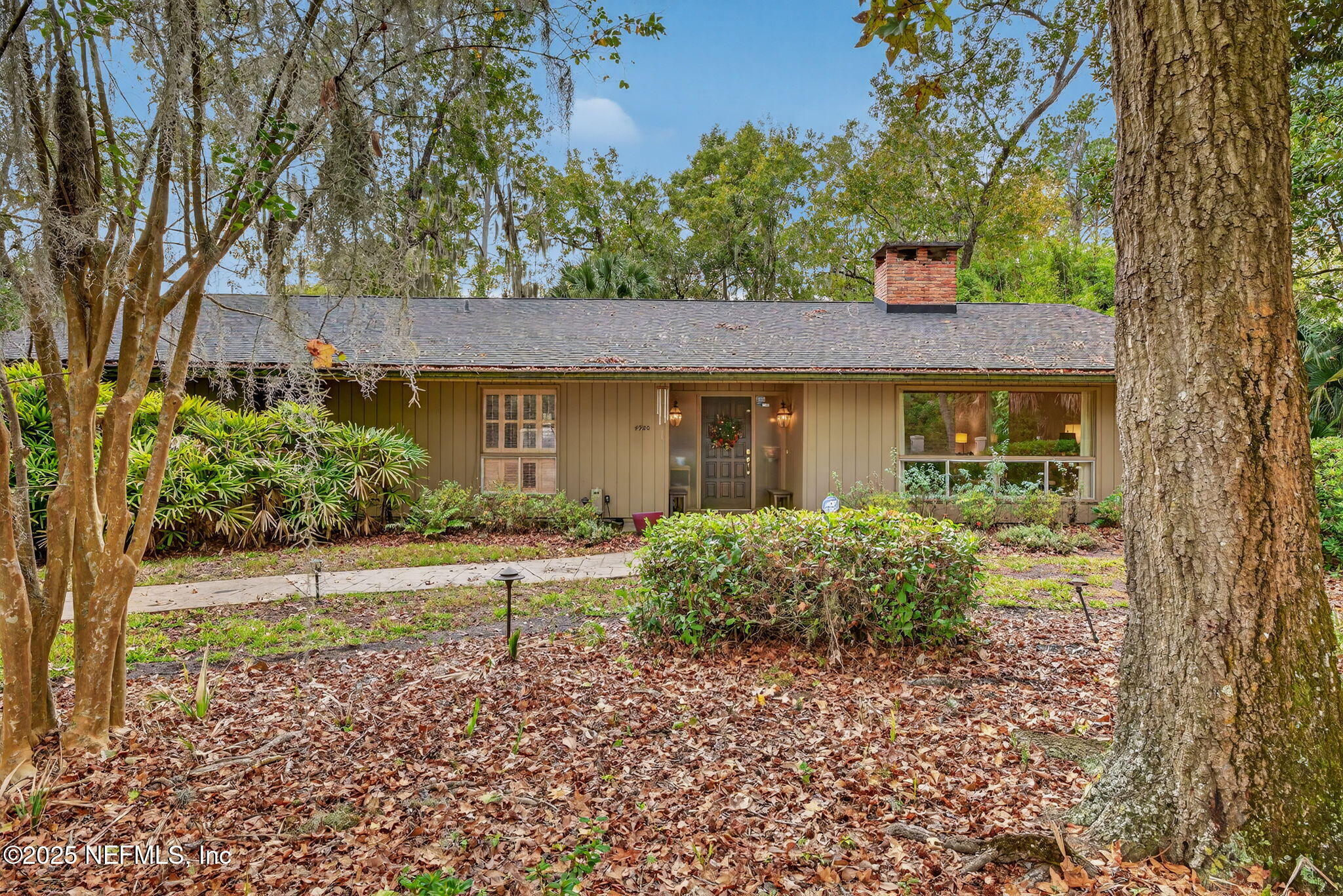 4980 Morven Road Jacksonville, FL 32210 - Photo 4 of 35 front view of a house with a yard