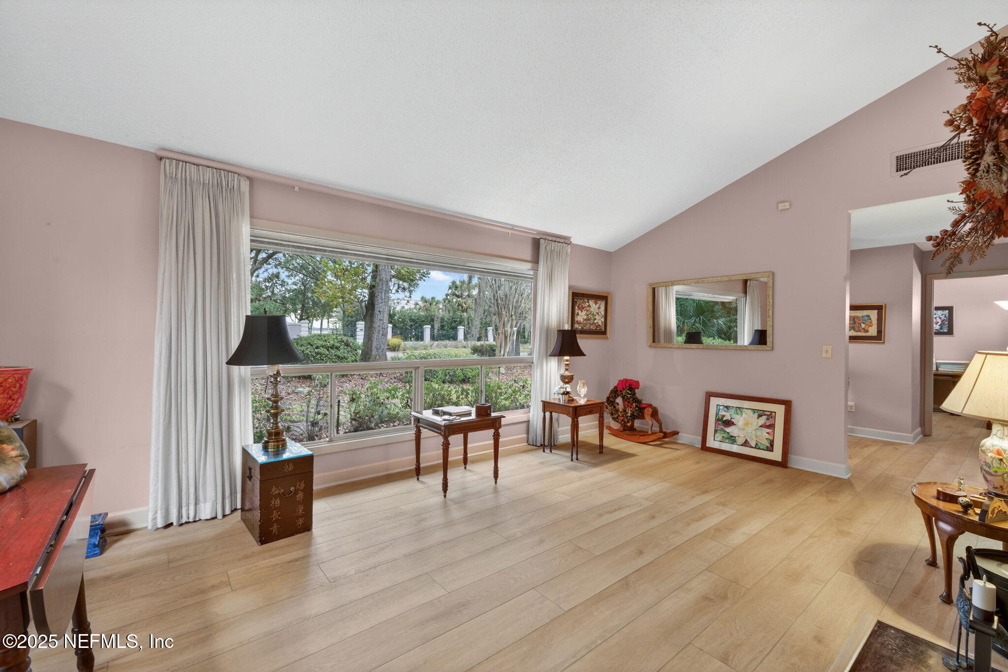4980 Morven Road Jacksonville, FL 32210 - Photo 7 of 35 a living room with furniture and a wooden floor
