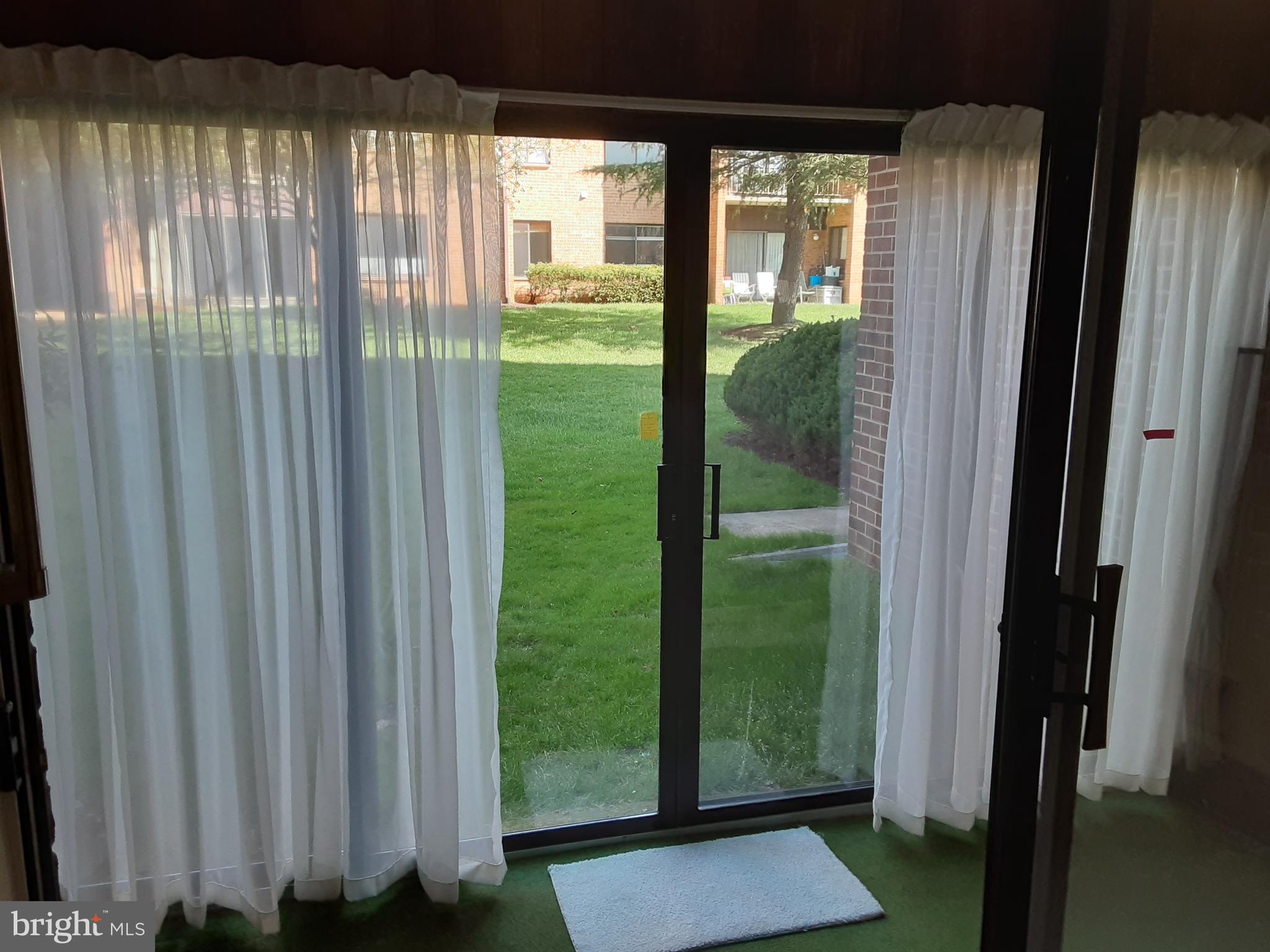 15320 Pine Orchard Drive, Unit 831B Silver Spring, MD 20906 - Photo 8 of 19 Glass enclosed porch