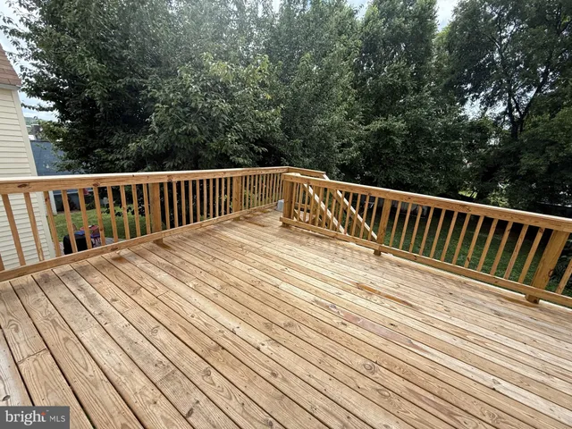 a view of deck with wooden floor and fence
