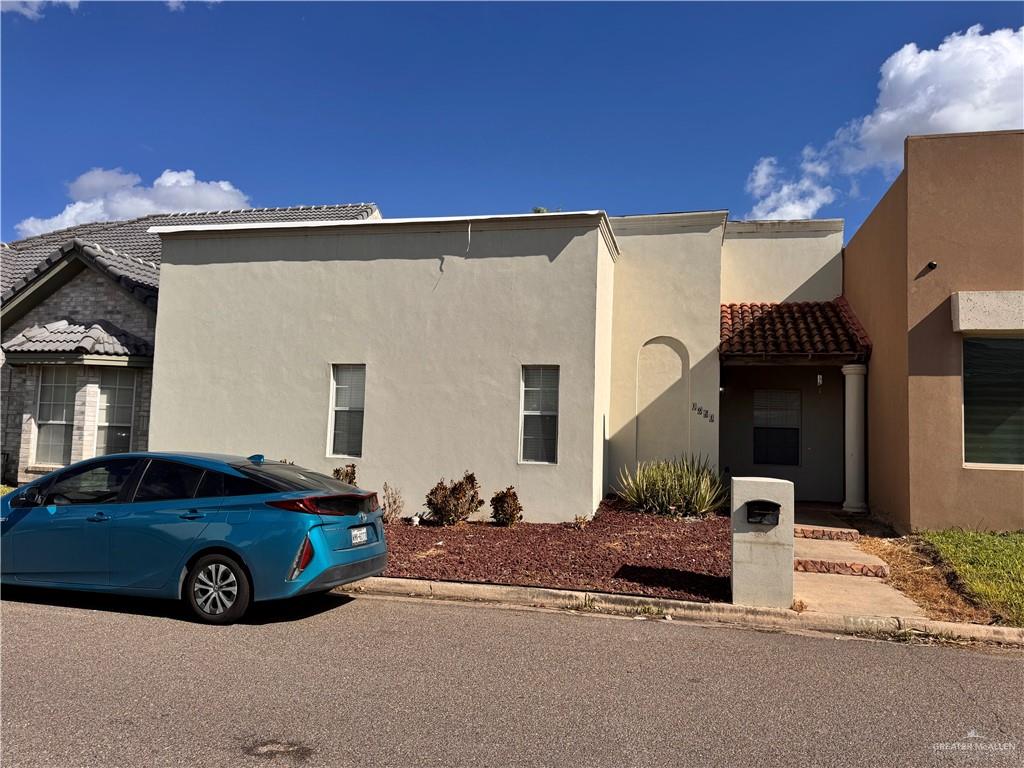 a blue house with trees in front of it