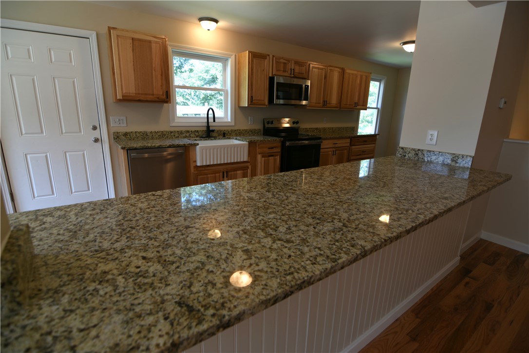 304 Getchell Avenue Woonsocket, RI 02895 - Photo 3 of 27 Kitchen with bar over hang