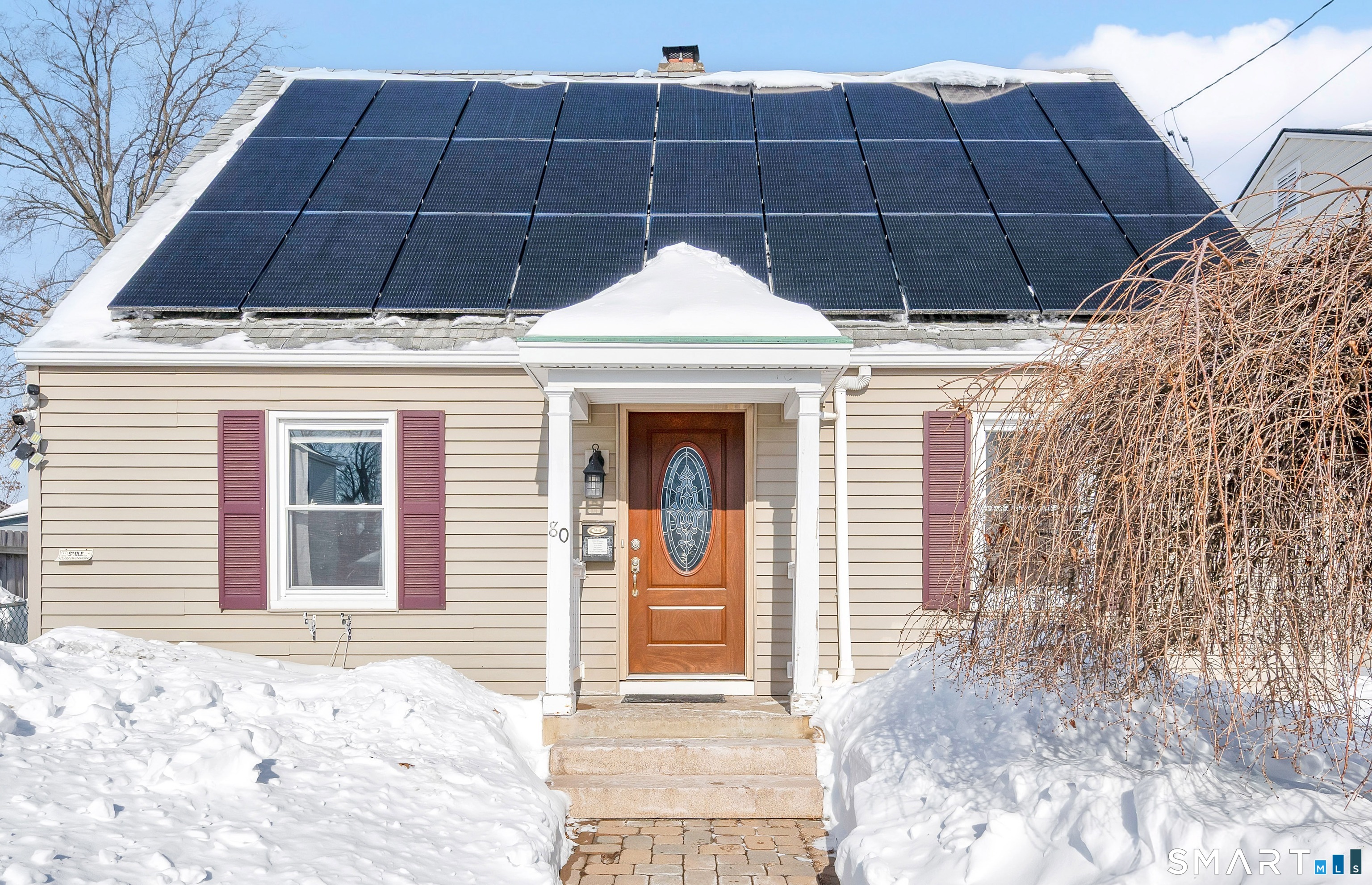 a view of a house with a snow on the wall