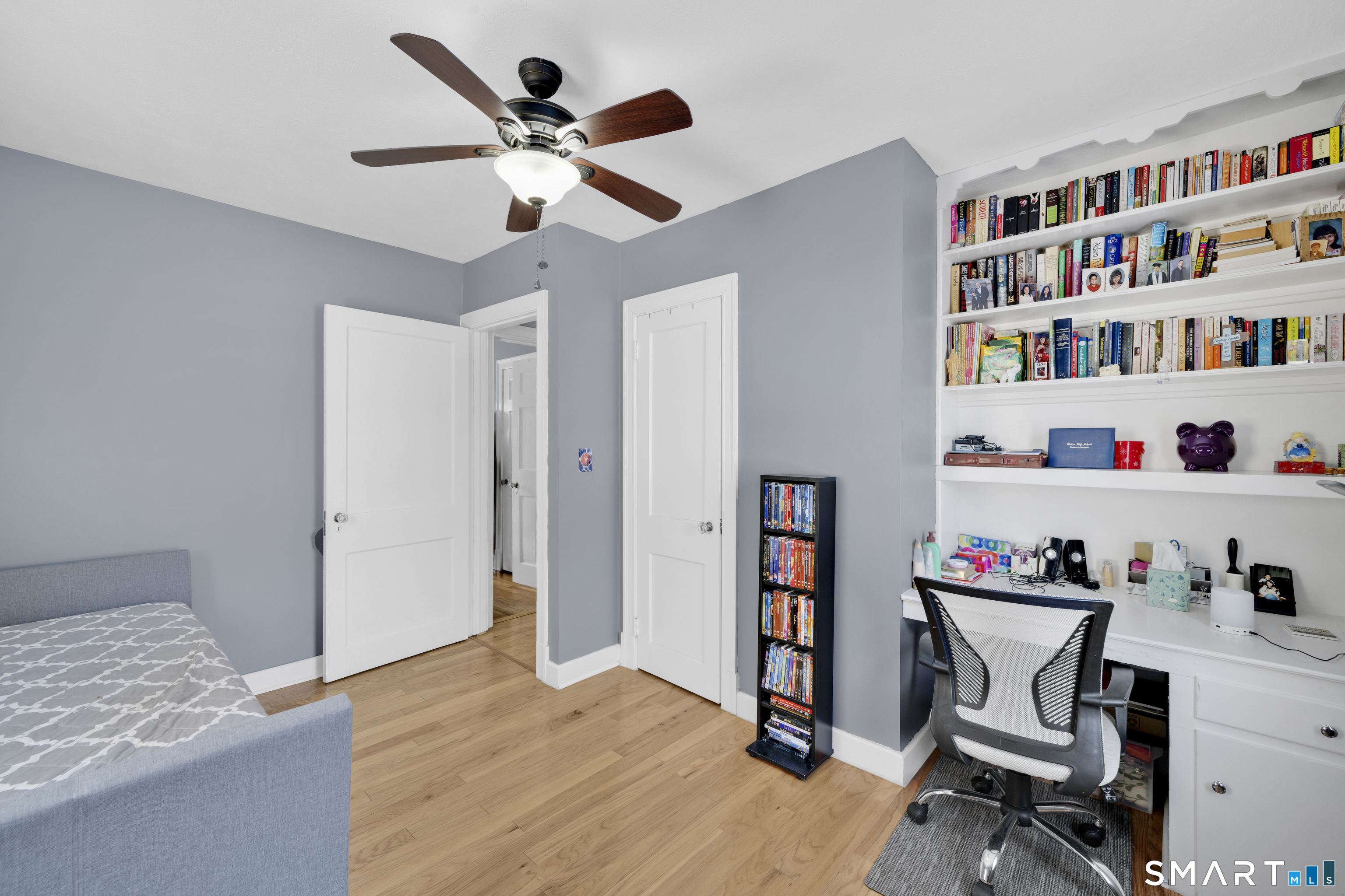 80 Cowles Street Hartford, CT 06114 - Photo 16 of 30 a workspace with a book shelf