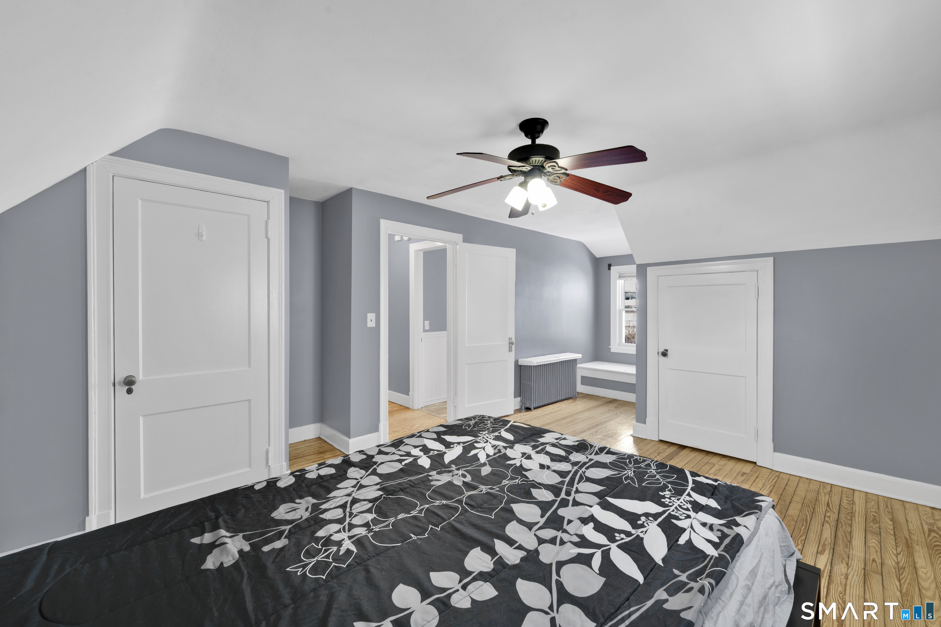 80 Cowles Street Hartford, CT 06114 - Photo 22 of 30 a bedroom with a bed and a chandelier