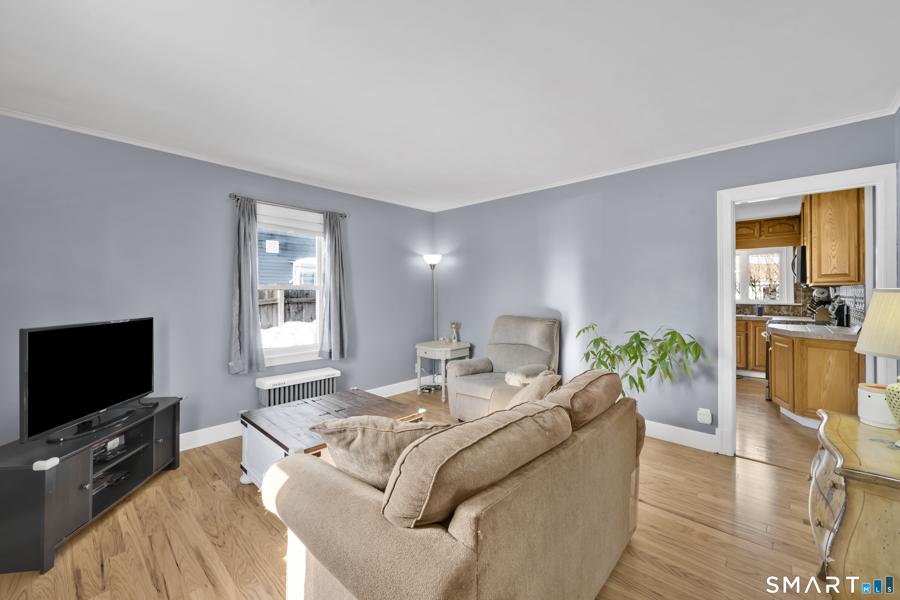 80 Cowles Street Hartford, CT 06114 - Photo 9 of 30 a living room with furniture and a flat screen tv