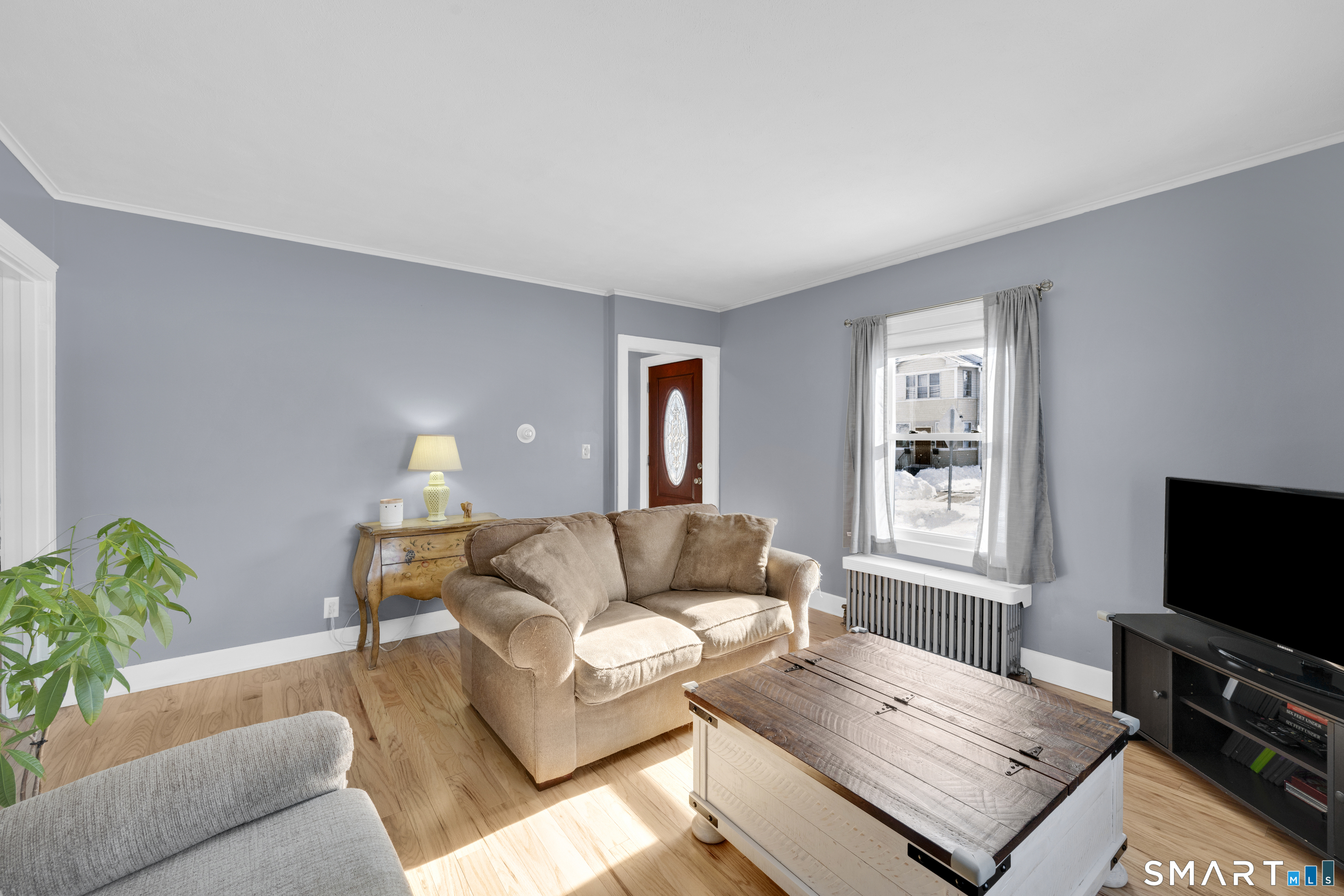 80 Cowles Street Hartford, CT 06114 - Photo 10 of 30 a living room with furniture and a flat screen tv