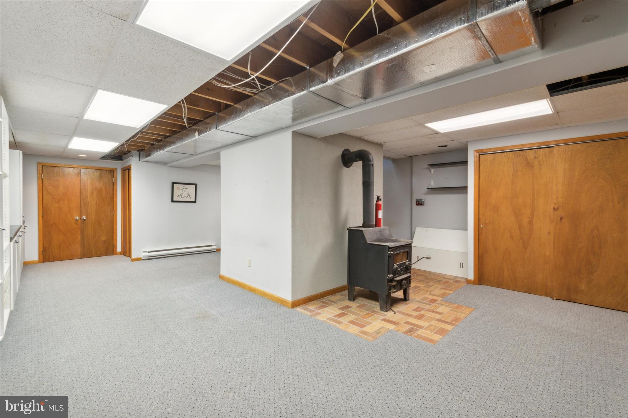 929 Store Road Harleysville, PA 19438 - Photo 35 of 40 Basement with wood stove