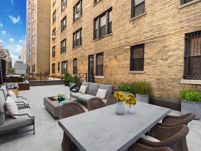 a bathroom with a toilet and a sink