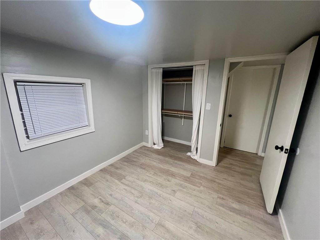 926 Moreland Avenue Southeast, Unit B Atlanta, GA 30316 - Photo 11 of 12 an empty room with wooden floor and windows