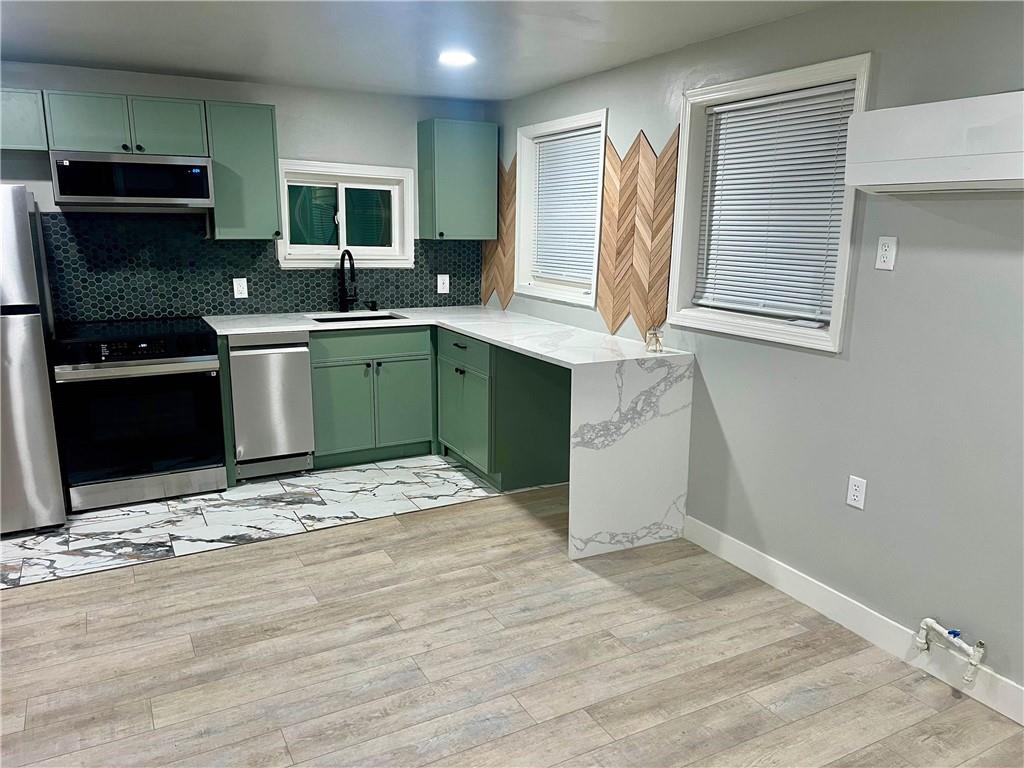 926 Moreland Avenue Southeast, Unit B Atlanta, GA 30316 - Photo 2 of 12 a kitchen with a sink stove and microwave