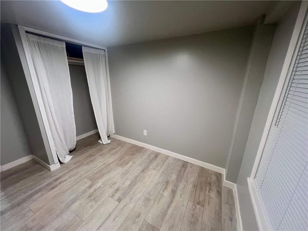 926 Moreland Avenue Southeast, Unit B Atlanta, GA 30316 - Photo 6 of 12 an empty room with wooden floor and entrance