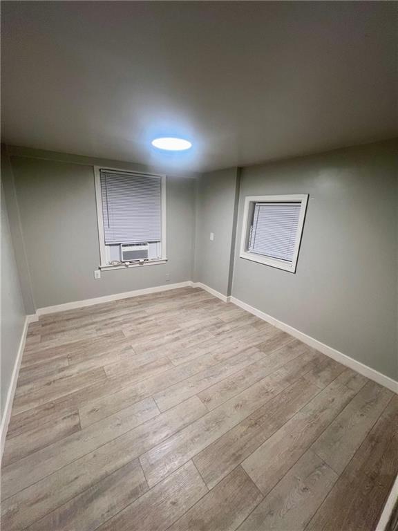 926 Moreland Avenue Southeast, Unit B Atlanta, GA 30316 - Photo 9 of 12 an empty room with wooden floor and windows