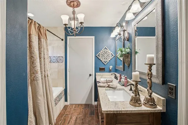 a dining room with furniture and chandelier
