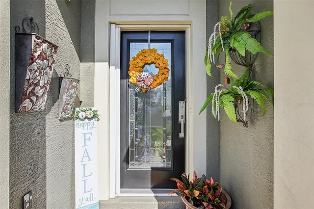 a vase of flowers sitting next to a window