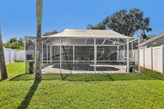 a view of a chair and table in the garden