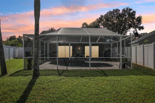 a view of a chair and table in the yard