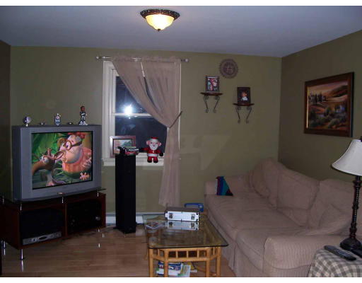 530 Barre Road Templeton, MA 01468 - Photo 5 of 5 a living room with furniture and a flat screen tv